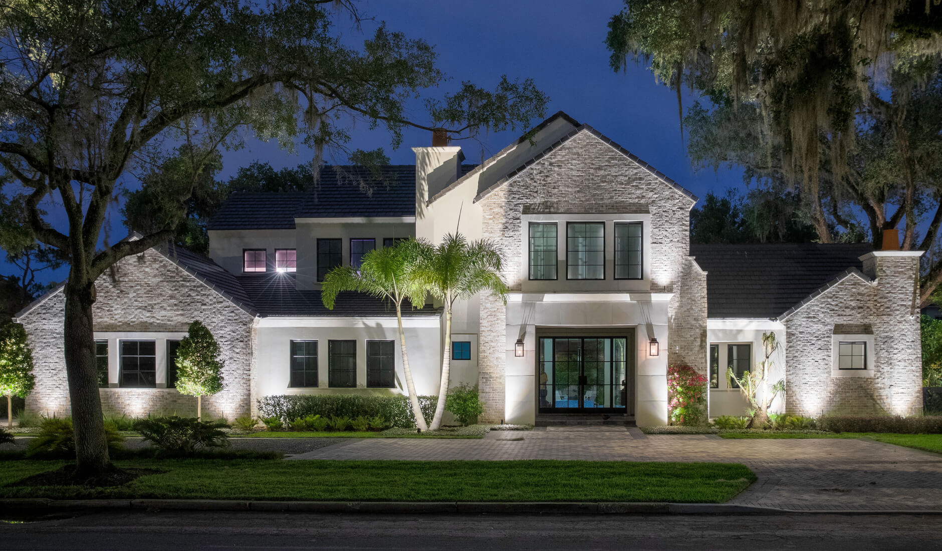 white house with outdoor curb appeal lighting