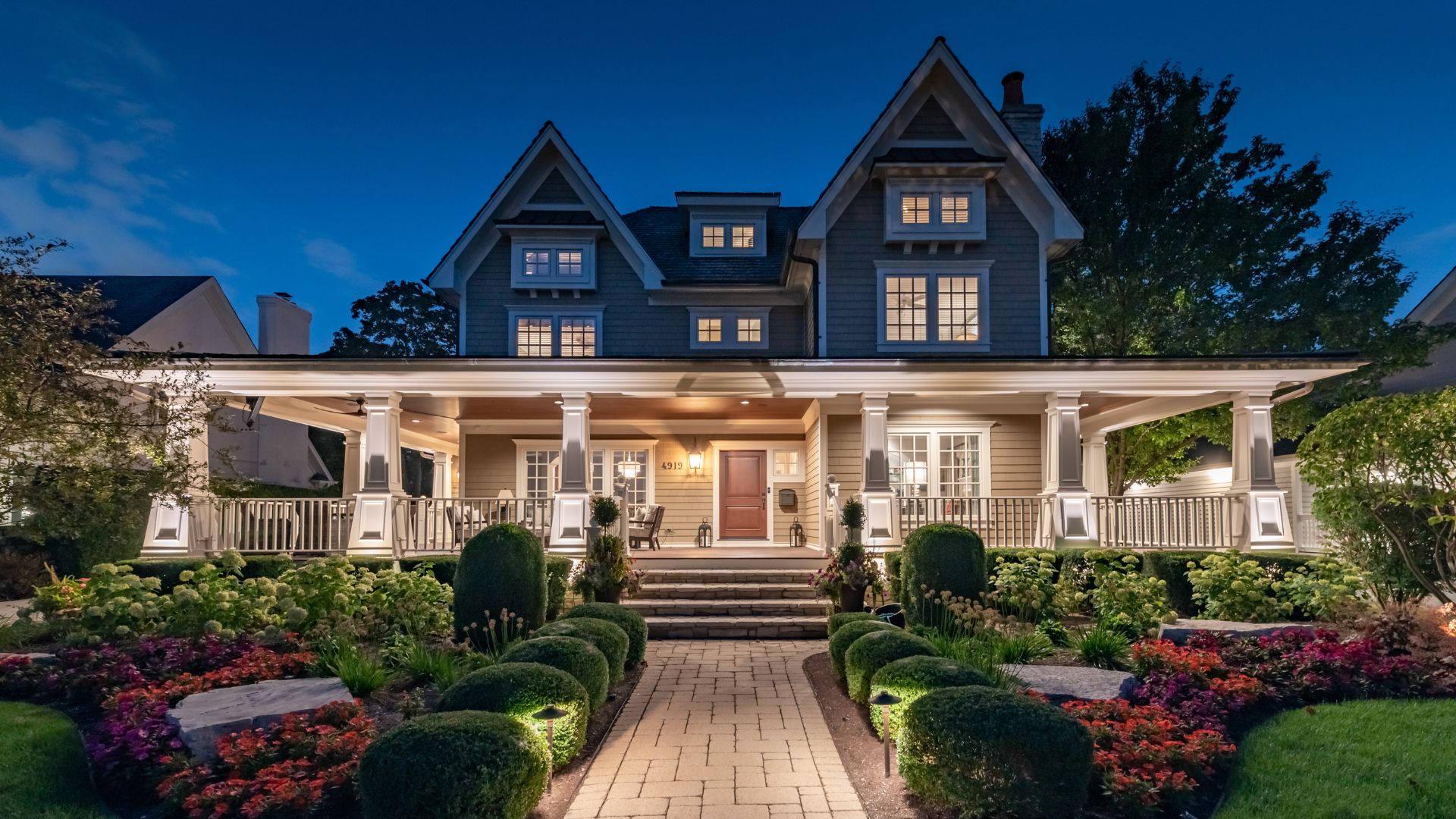 A house with a garden and bushes