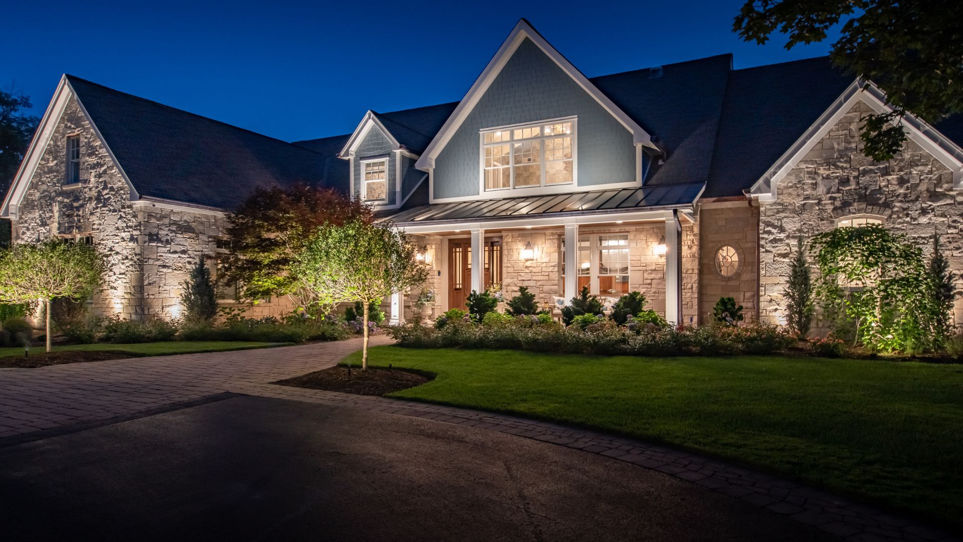 front of a house lit up