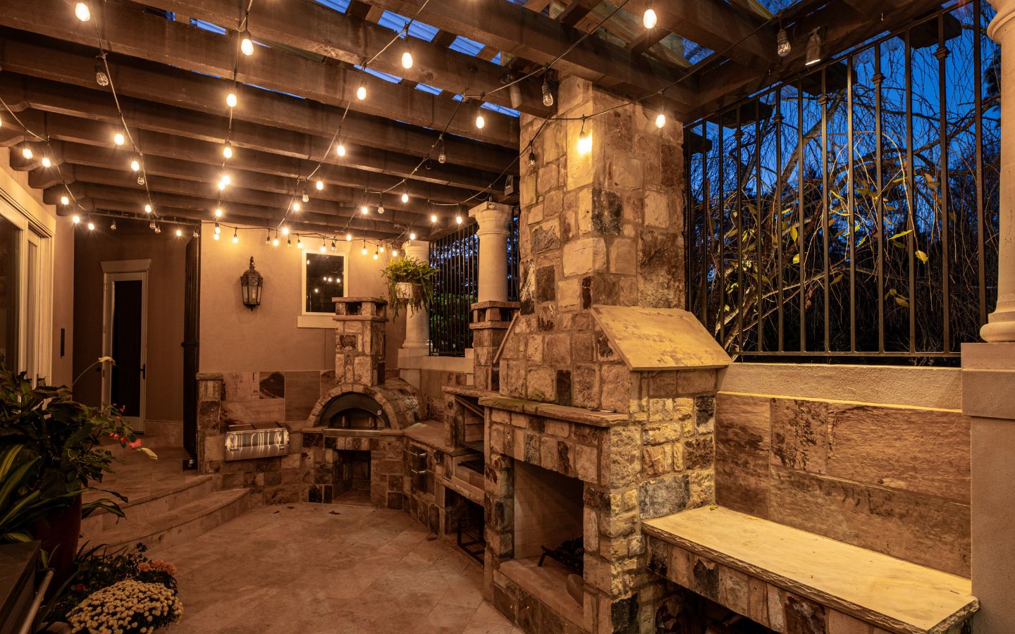 outdoor stone kitchen with lighting