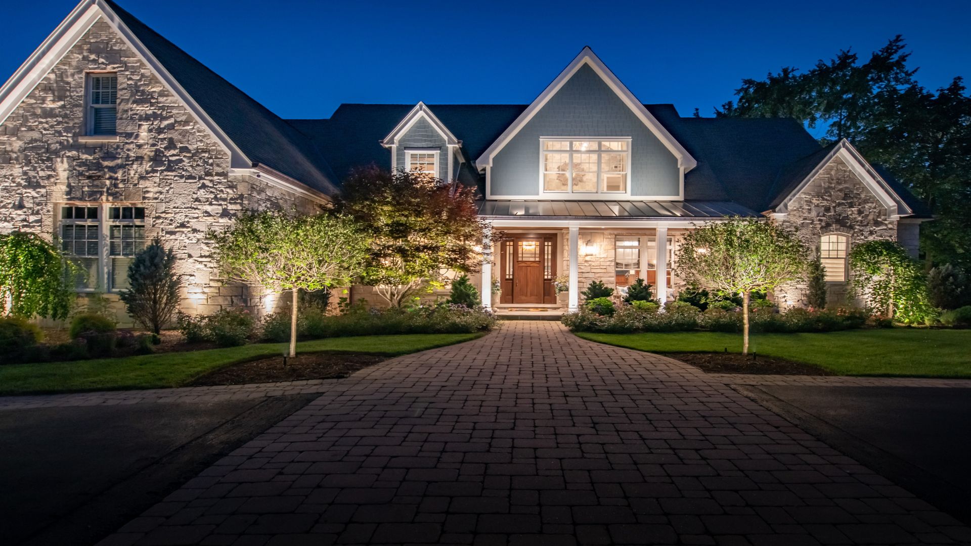 front of a house lit up