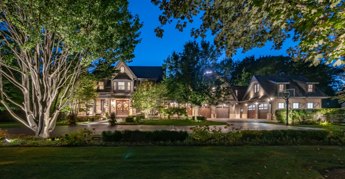 outdoor lighting on a large brown house