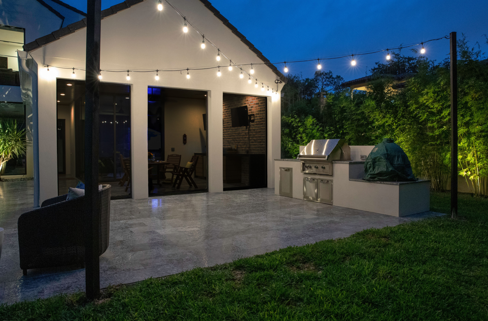 backyard illuminated with outdoor lighting