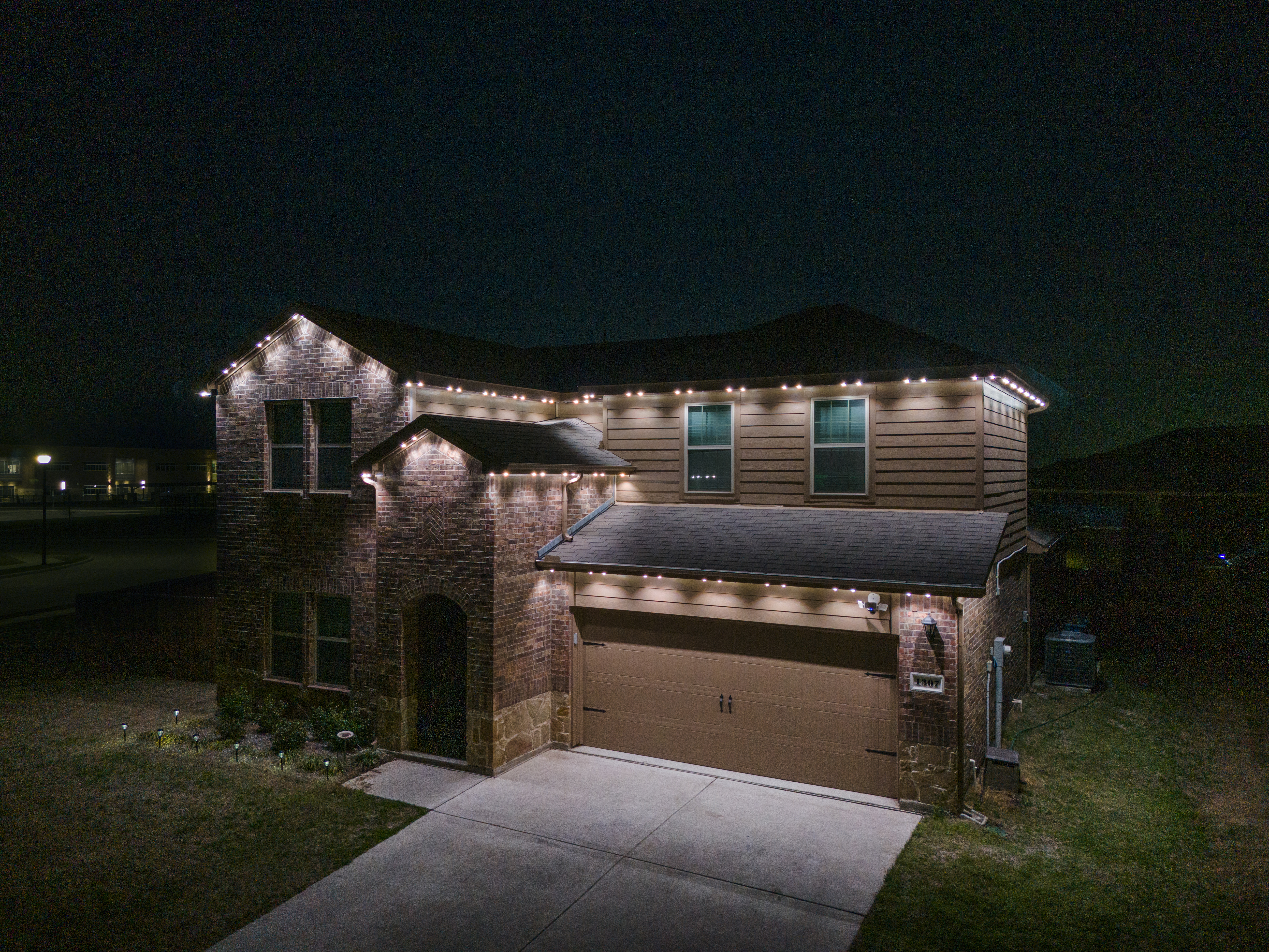 Home with outdoor lighting