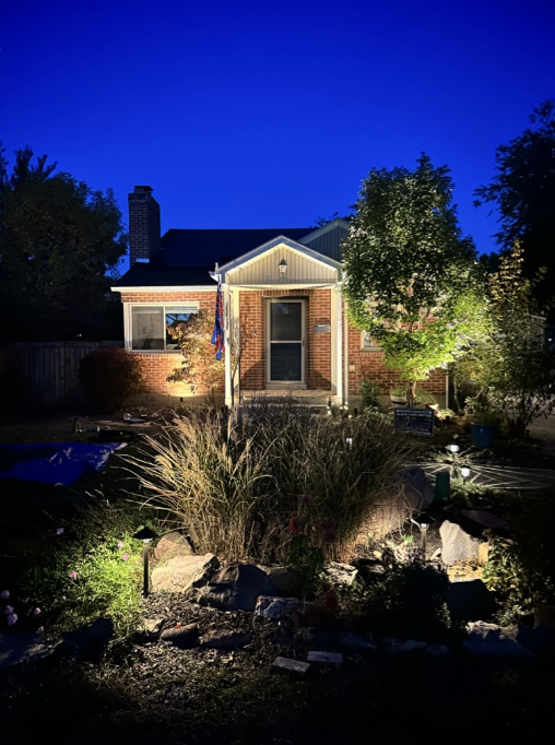 house with exterior lights and garden lighting