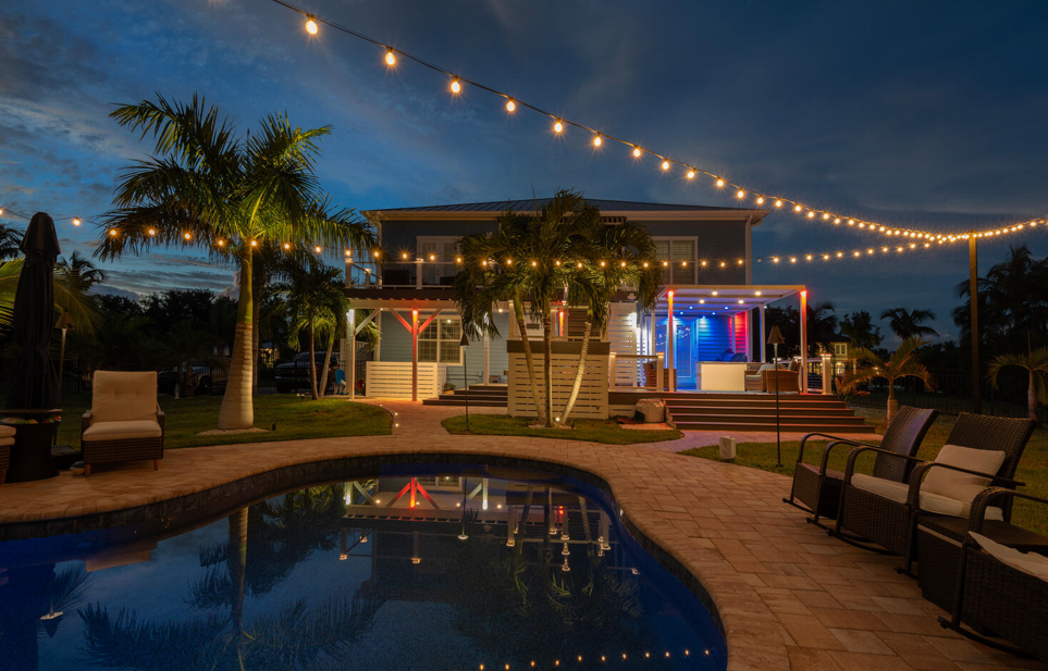 backyard illuminated with outdoor lighting